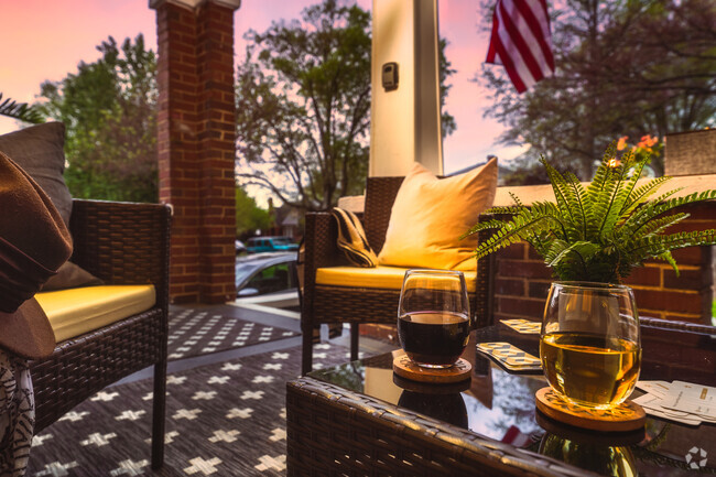 A charming outdoor space with cozy seating, warm lighting, and sunset views - 715 Grandin Rd