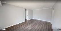 This contemporary 890 square foot apartment in Herndon, VA offers a well-designed living space with two bedrooms and two bathrooms. The open-concept layout features a spacious living area with sleek hardwood flooring and ample natural light from large windows. The updated kitchen boasts white cabinetry, stainless steel appliances, and a convenient layout for meal preparation. Both bedrooms are generously sized, with the primary bedroom measuring 160 square feet and featuring plush carpeting and a large window. The bathrooms are modern and functional, with one showcasing a single vanity and large mirror. Throughout the apartment, a neutral color palette of light gray walls and white trim creates a fresh, airy ambiance. Additional features include closet space with sliding doors, track lighting, and a sliding glass door leading to an outdoor area. The apartment's single-story layout and thoughtful design make it an ideal space for comfortable, contemporary living.