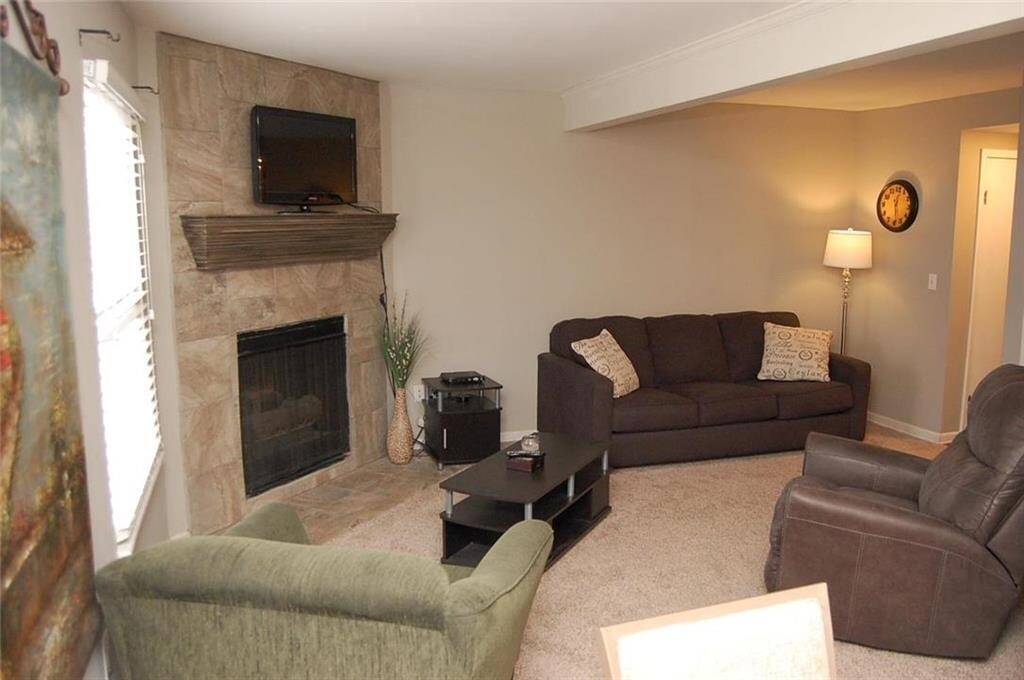 New floor to ceiling ceramic tile added around fireplace - 8610 W. 109th St,