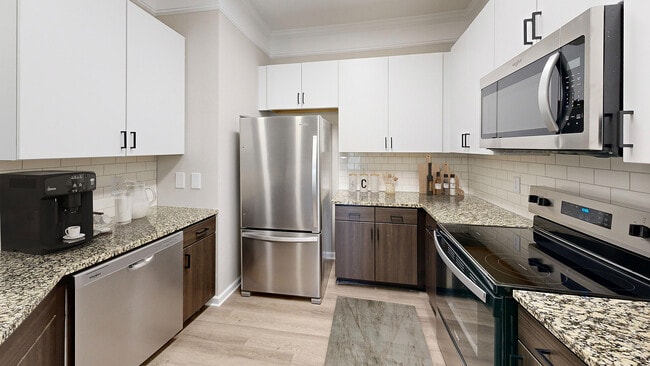Newly Renovated Kitchen with Stainless Steel Appliances - Waterstone at Brier Creek Apartments