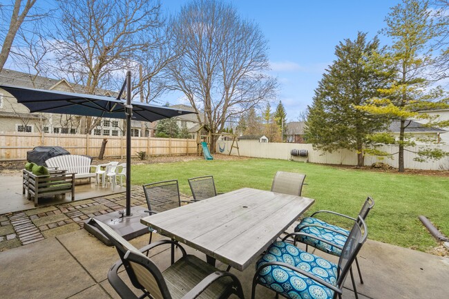 Backyard patio - swing set - 316 Iroquois Ave