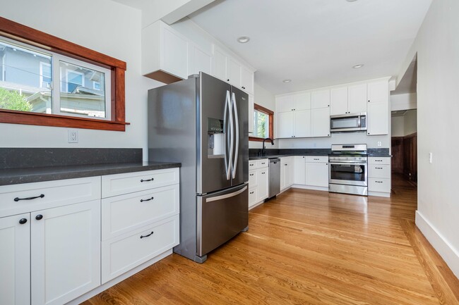 Newly renovated kitchen with updated appliances. - 431 Athol Ave