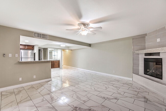Living Room with Fireplace - Country Club Towers