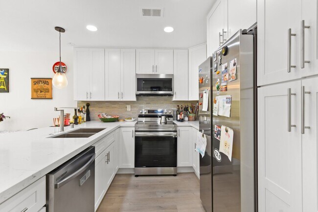 Building Photo - Modern Living Meets Urban Charm in Bankers...