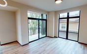 This contemporary apartment, located at 531 W Washington Ave in Madison, WI, offers a spacious 1040 square feet of living area on a single floor. The unit boasts three bedrooms, including a primary bedroom of 150 square feet, and three full bathrooms. The open-concept design seamlessly integrates the kitchen and dining area, creating a fluid living space ideal for both everyday life and entertaining.

Large windows throughout the apartment flood the rooms with natural light and provide scenic views of the surrounding area. A standout feature is the balcony access, offering residents an outdoor extension of their living space. The kitchen is equipped with modern stainless steel appliances, ample cabinetry, and a sleek island with a built-in sink.

Hardwood floors run throughout the apartment, adding warmth and sophistication to the space. The bathrooms feature clean lines with white fixtures and vanities, complemented by wood accents. Ceiling fans in the bedrooms provide additional comfort and air circulation.

The apartment's neutral color palette and contemporary finishes create a fresh, modern ambiance. With its thoughtful layout and high-quality features, this apartment offers a blend of style and functionality in the heart of Madison.