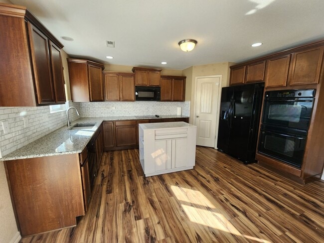Building Photo - Stunning 4 Bed 3 Bath Home Near Peterson A...