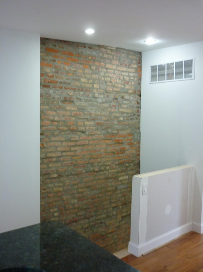exposed brick spiral steps below - 3815 Pearl St