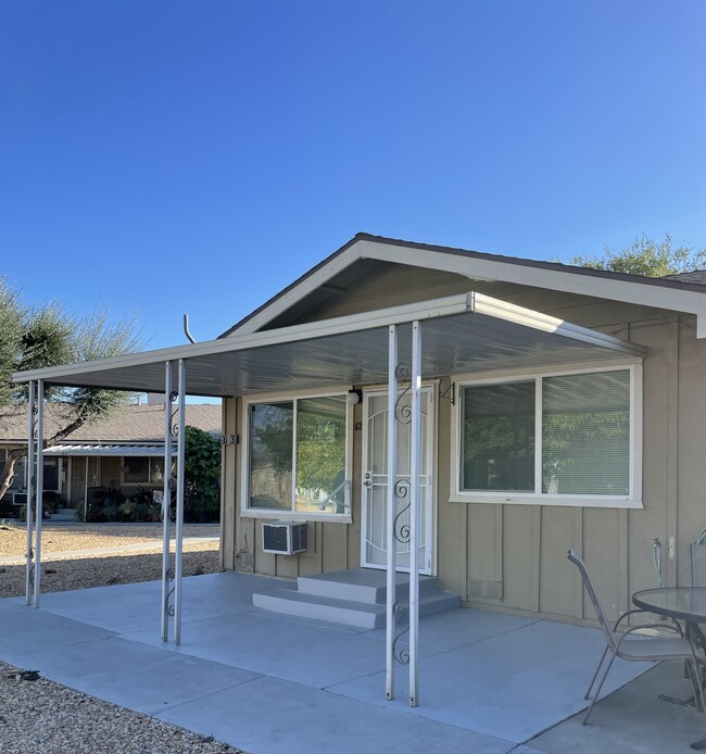 Covered front porch - 150 E Lakeshore Dr