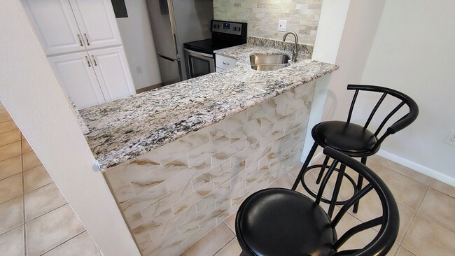 View from DR into kitchen - 1353 Pine Ridge Cir E Apartment