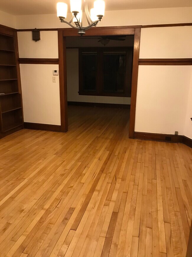 hardwood floors throughout living room and bedrooms - 2102 E Mifflin St