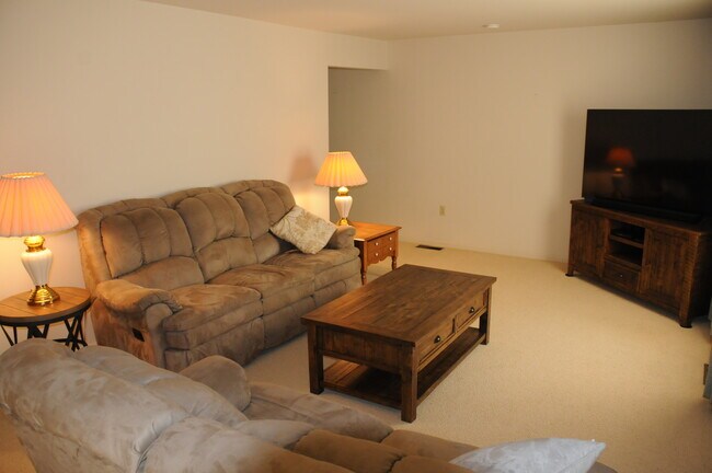 Living room with big screen TV. - 21 Cambridge Ct