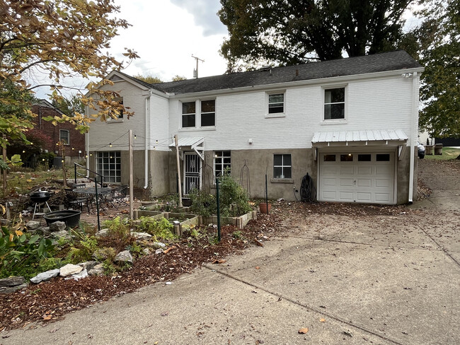 Rear of house showing front door of apartment. - 2501 Barclay Dr