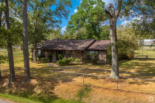 One-story ranch-style home on an acre lot surrounded by natural beauty in Channelview.