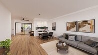 This 820-square-foot, single-story apartment offers a thoughtfully designed layout comprising one bedroom, two bathrooms, a living room, kitchen, and closet. Warm hardwood flooring flows consistently throughout the unit, creating a cohesive and inviting aesthetic.

The living room is bright and open, featuring crown molding, a large sliding glass door that invites natural light and provides outdoor views, and ample space for comfortable seating arrangements. The kitchen is well-equipped with white shaker-style cabinetry, white quartz countertops, a blue tile backsplash, black hardware accents, and stainless steel appliances including a side-by-side refrigerator.

The primary bedroom measures 210 square feet and features a wall-mounted TV, access to an en-suite bathroom, and a dedicated closet. A window with exterior views adds natural light to the space. Both bathrooms are finished with white vanity cabinetry, black hardware, and wood-look flooring. One bathroom includes a tub-shower combination with striking floor-to-ceiling blue tile and a sliding glass enclosure.

The unit also features a secondary room that functions as a versatile flex or entry space. Crown molding, recessed lighting, and a consistent neutral color palette throughout contribute to a clean, modern ambiance.