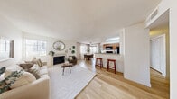 Located at 1800 N Green Valley Parkway in Henderson, Nevada, this well-appointed 2-bedroom, 3-bathroom residence offers a thoughtfully designed single-level layout. Light wood-style flooring flows throughout, lending a clean and cohesive aesthetic to every room.

The kitchen is a functional centerpiece, featuring warm wood cabinetry, granite-style countertops, black appliances including a gas range, microwave, and refrigerator, and a peninsula with bar seating that opens toward the main living area. Natural light filters through the windows, brightening the space.

The living room is inviting and spacious, anchored by a tiled fireplace and neutral walls that create a calm, airy atmosphere. A dedicated entrance leads directly into this comfortable gathering area.

The primary bedroom is generously sized, bathed in natural light from a large window, and finished with the same light wood flooring. The second bedroom is equally comfortable, with soft neutral tones and a closet for storage. Both rooms offer a serene retreat.

Three full bathrooms serve the residence, each featuring granite-topped vanities, wood cabinetry, and tub-shower combinations with clean white tile surrounds. Two dedicated closets provide ample storage throughout the home. A hallway connects the private quarters, completing the practical and comfortable floor plan.