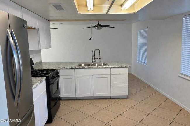 Building Photo - 8819 W Roma Ave