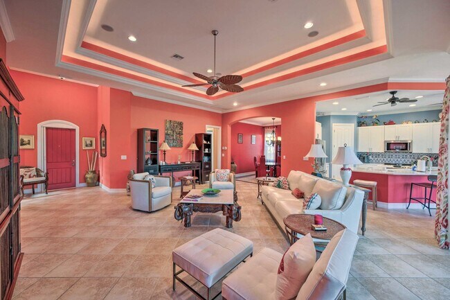 Air living room with ceiling fans. - 7688 Cottesmore Dr