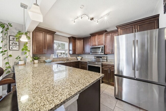 Building Photo - Charming Corner Lot Pool Home with Private Orchard Florida Living at Its Best – Pool, Privacy & P...