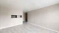 Located at 8515 Hammerly Blvd in Houston, Texas, this single-story, two-bedroom, one-bathroom unit offers a clean and functional layout across a comfortable footprint. Light-toned large-format tile flooring runs consistently throughout the space, lending a cohesive and easy-to-maintain aesthetic.

The open living area is bright and welcoming, featuring neutral warm-beige walls, crisp white baseboards, and a pass-through window with stone tile accents that connects to the kitchen — an ideal feature for casual interaction between rooms. The kitchen includes a built-in stove and countertop space.

Both bedrooms are well-proportioned, with ceiling fans providing year-round comfort. The primary bedroom is notably spacious and benefits from a window that brings in natural light. The second bedroom mirrors the same clean design with its own ceiling fan and closet access.

A shared full bathroom is accessible from the hallway and features large-format wall tile in the tub/shower surround, a toilet, and a granite-topped vanity nearby. Two hallways efficiently connect the living and sleeping areas, with an additional closet providing practical storage.

The space presents a move-in-ready, neutral palette ideal for a variety of furnishing styles, situated conveniently in the Spring Branch area of Houston.