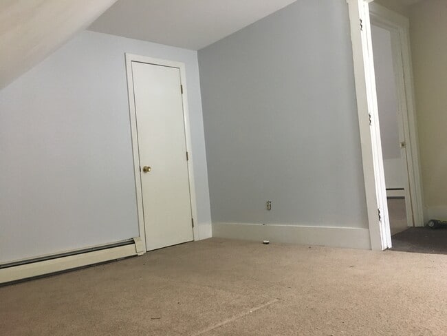 Upstairs bedroom #1. The bedrooms are modest, but as you can see they get good light. - 12 Boynton Street