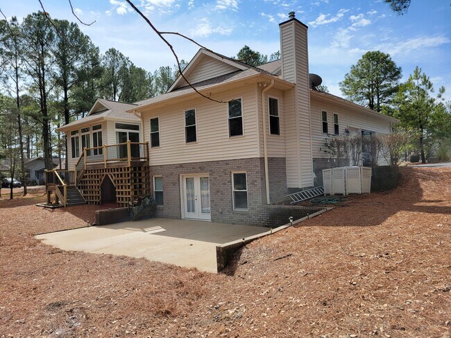 Right side rear of home - 101 Huntington Ct