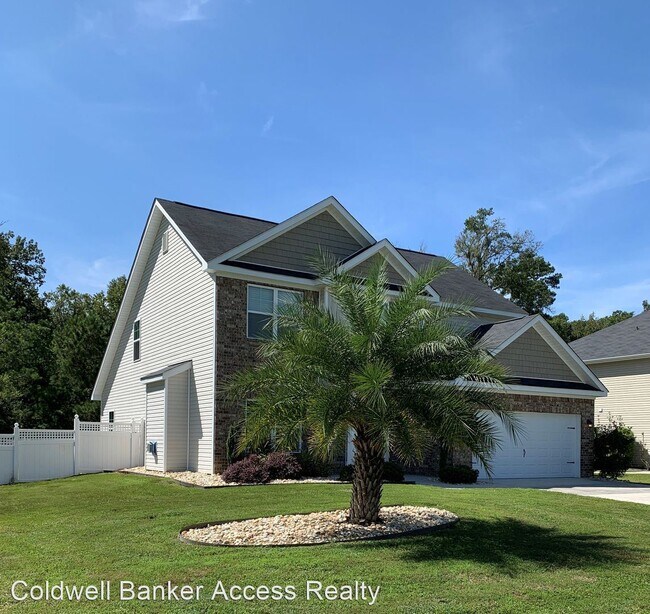 Building Photo - 4 br, 2.5 bath House - 1061 Woodland Dr.