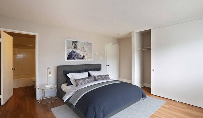 Bedroom with a large closet and wood flooring - Pacifica Park