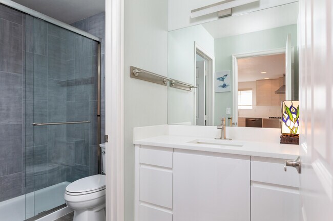 Full bath with shower on main level of home. - 8562 Stone Ave N