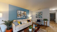 Located at 2501 Riverfront Dr in Little Rock, Arkansas, this single-floor residence offers a cohesive and modern interior design with a warm, livable aesthetic. The living room serves as the heart of the home, featuring a striking teal accent wall, wood-style flooring, and a corner fireplace with a wall-mounted television above. Large windows allow natural light to filter in, complementing the open, comfortable feel of the space.

Adjacent to the living area, the dining space accommodates a round glass-top table and provides additional natural light through a sizable window with blinds and navy curtain accents. A large framed mirror enhances the sense of space in this area.

The kitchen is outfitted with white shaker-style cabinetry, granite countertops, and a full suite of stainless steel appliances, including a refrigerator, electric range, and built-in microwave. Wood-style flooring continues throughout, adding visual continuity.

The bedroom features soft carpet, a ceiling fan, a cool blue-grey accent wall, and a generously sized closet with sliding doors. Matching nightstands and warm lighting contribute to a restful atmosphere.

The bathroom includes granite-topped vanity cabinetry, wood-style flooring, and a tub-shower combination. The consistent use of neutral tones and quality finishes throughout creates a polished and inviting living environment.