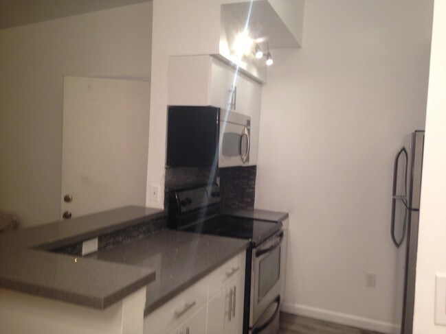 New kitchen with stainless steel appliances - 19740 SW 103rd Ct