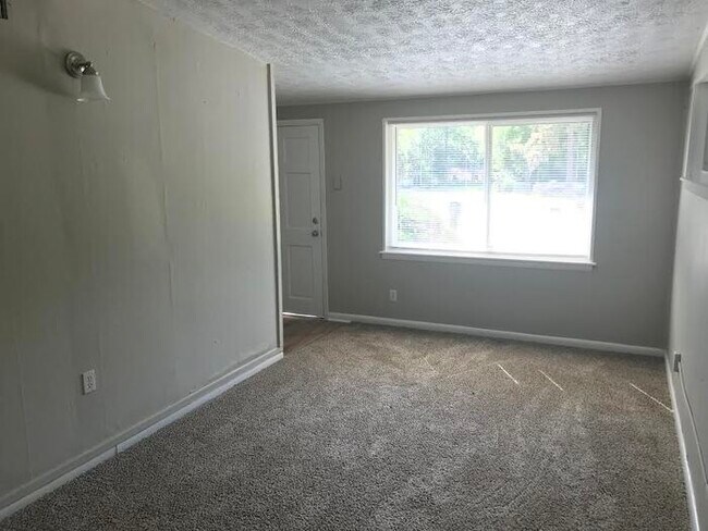 Building Photo - Spacious 4 Bedroom Home With Garage And Modern Updates