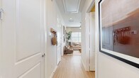 Located in Anna, TX, this well-appointed 2-bedroom, 3-bathroom single-story home offers a thoughtfully designed layout with modern finishes throughout. Light wood flooring flows seamlessly from the welcoming entry hallway through the main living areas, creating a bright and cohesive aesthetic.

The kitchen is a standout feature, boasting white shaker cabinetry extending to the ceiling, stainless steel appliances, a large center island with white countertops, and pendant lighting — ideal for both cooking and casual dining. The adjacent living room is comfortably proportioned, with a ceiling fan, recessed lighting, and natural light from large windows fitted with blinds.

Both bedrooms are serene and well-lit, with ceiling fans, large windows, and ample closet space. The spacious primary bedroom offers a comfortable retreat, while the second bedroom doubles well as a guest room or home office. The three bathrooms are clean and modern, featuring white vanities, tile accents, and thoughtful decorative touches.

A dedicated laundry room with a stacked washer and dryer and built-in shelving adds everyday convenience. Throughout the home, the neutral color palette, consistent flooring, and clean architectural lines create a calm, functional living environment.