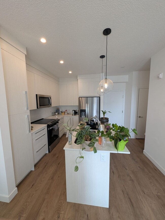 Building Photo - Modern 2 Bedroom + Den Condo with Underground Parking in Skyview Ranch (IP059)