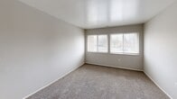 Located at 26382 Colgate Dr in Inkster, Michigan, this single-floor, 2-bedroom, 1-bathroom home offers a practical and comfortable layout with a variety of functional spaces. The combined living and dining room serves as the heart of the home, featuring neutral-toned carpet, clean white ceilings, and a sliding glass door that invites natural light and provides outdoor access. The open feel of this shared space makes it ideal for both everyday living and entertaining. The kitchen is well-appointed with dark wood cabinetry, marble-look countertops, a stainless steel sink, and a gas range, complemented by a dedicated pantry for additional storage. Two carpeted bedrooms offer comfortable retreats; the primary bedroom is generously sized, while the secondary bedroom features wide windows that fill the room with natural light and includes a closet. The full bathroom includes a vanity with a wide countertop, an illuminated mirror, and warm wood-toned cabinetry. Throughout the home, five closets provide exceptional storage capacity. A hallway connects the main areas efficiently, and a utility room adds further functionality. The neutral color palette and clean finishes throughout create a bright, move-in-ready atmosphere.