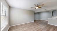 Located at 3205 E Olive Rd in Pensacola, Florida, this single-story, 2-bedroom, 4-bathroom home offers a thoughtfully designed layout with contemporary finishes throughout. The open living area welcomes residents with durable wood-look laminate flooring, neutral gray-toned walls, and a ceiling fan, creating a bright and comfortable atmosphere. A pass-through opening connects the living space to the kitchen, which features gray shaker-style cabinetry, white countertops, a subway tile backsplash, stainless steel appliances including a refrigerator, range, microwave, and dishwasher, and a double-basin sink — all set over matching laminate flooring.

Both bedrooms are carpeted and equipped with ceiling fans, offering a cozy feel. Natural light enters through blinds-fitted windows, and each room includes dedicated closet space. The four bathrooms are finished consistently with gray vanity cabinetry, white countertops, brushed nickel fixtures, and framed mirrors. At least one bathroom features a full tub-shower combination with classic white subway tile surround. The cohesive, modern aesthetic and practical floor plan make this home a functional and attractive living space.