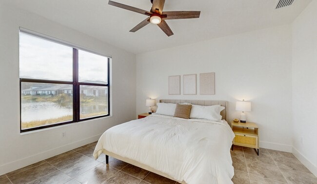 Primary bedroom King size bed with water view - 13071 Georges Cay Pl