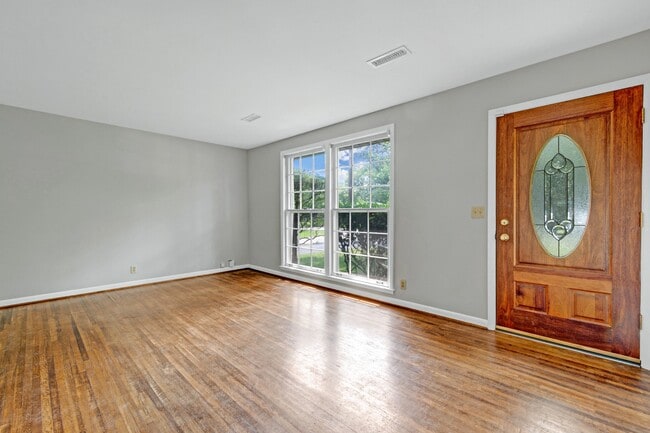 Living room with large windows - 5017 W Durrett Dr