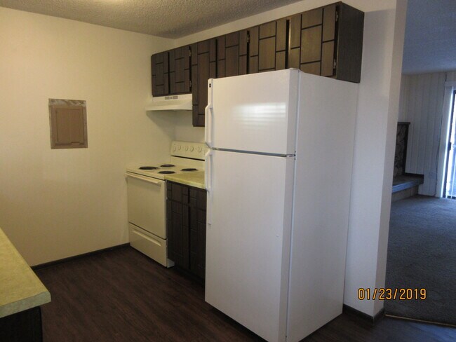 kitchen range, refrigerator - 8910 E Broadway Ave