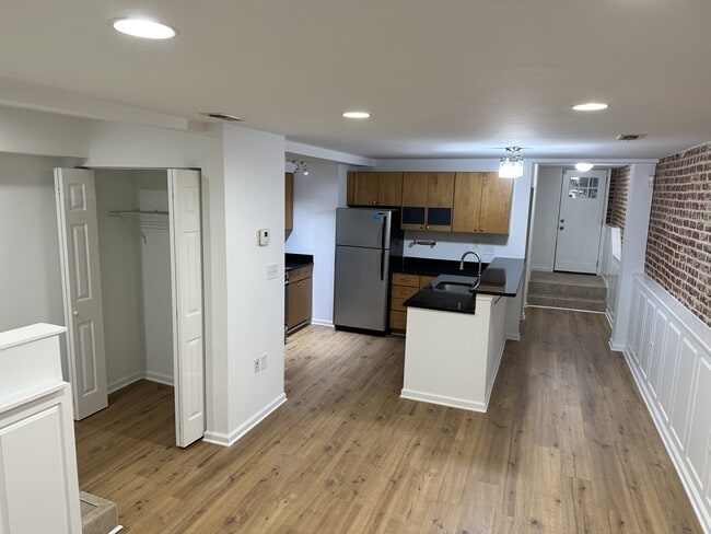 Basement apartment entry closet to open floor design - 71 W St NW