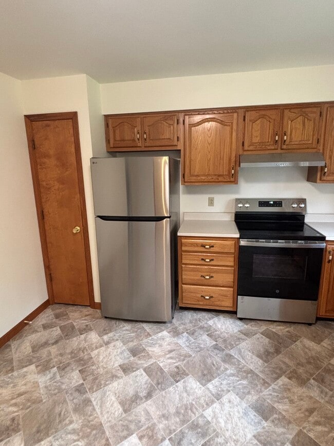 Spacious kitchen with new refrigerator, stove and closet/pantry - 10 Burke Dr