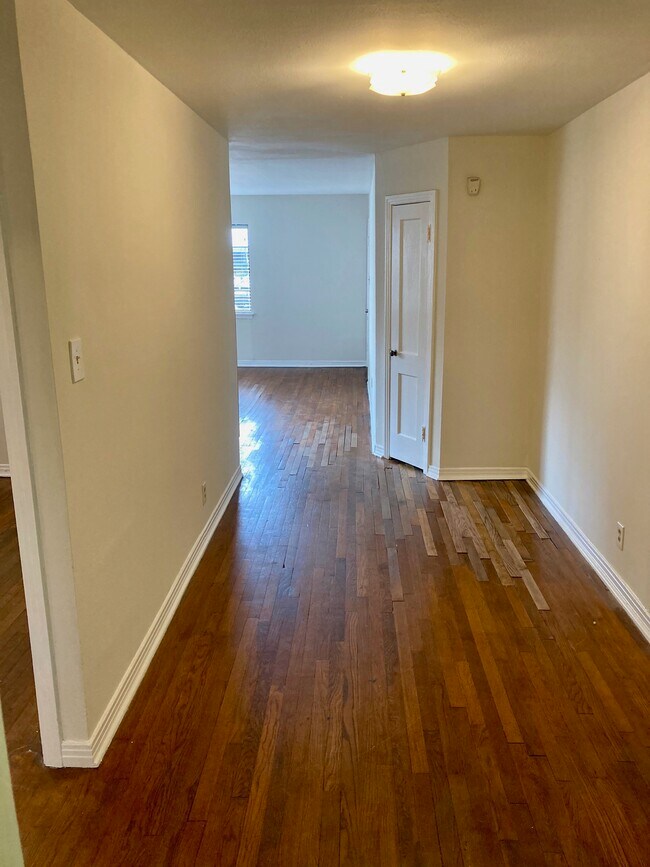 Space between kitchen and Living Room, great spot for table. Large walk in closet behind door - 3817 S Shepherd Dr