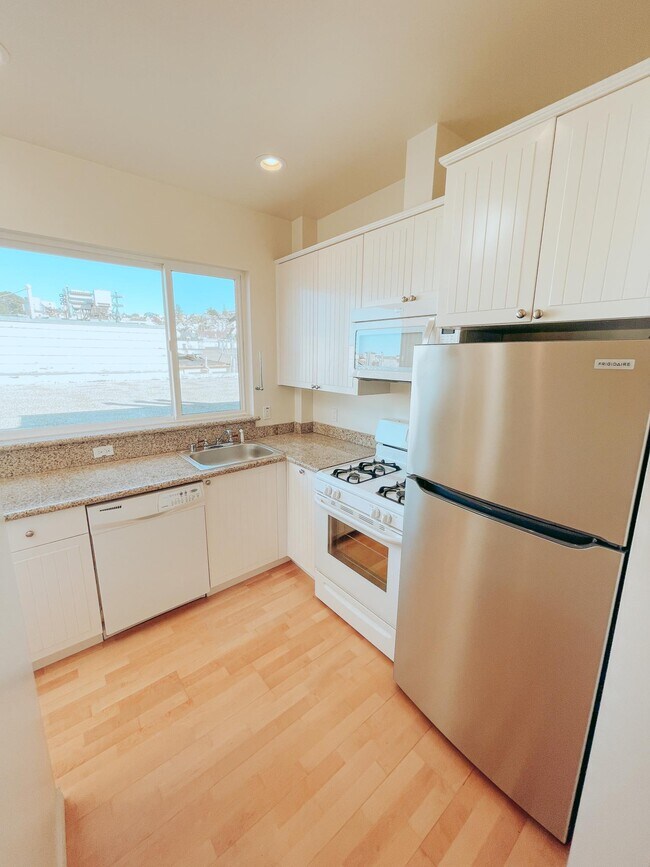 Kitchen with Dishwasher, Stainless Steel Fridge, Oven, and Microwave - 121 Carl St
