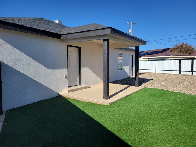 Turf/Gravel backyard with storage room - 3128 Westminster Dr