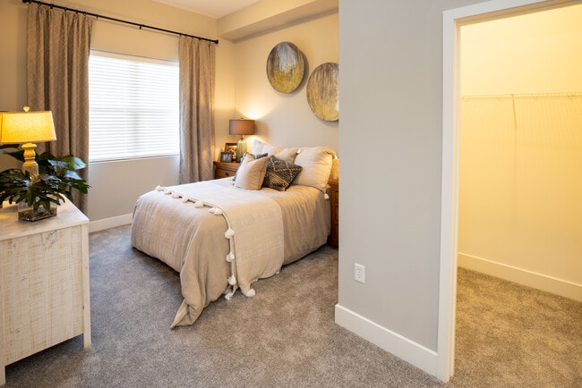 Furnished Model Unit- Master Bedroom showing closet - Renaissance Park Apartments