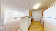Located at 5000 Lydianna Ln in Suitland, MD, this single-floor, 3-bedroom, 1-bathroom home offers a practical and well-organized layout. The living room is a bright, open space with soft neutral carpeting, recessed lighting, and a window that fills the room with natural light. It flows seamlessly into the kitchen, which is separated by a peninsula breakfast bar. The kitchen features warm honey-toned wood cabinetry, light countertops, tile flooring, a white electric range, dishwasher, and refrigerator — providing ample storage and functionality. The three bedrooms are carpeted and bright, each with windows offering exterior views and generous wall space. The spacious primary bedroom includes two closets, adding notable storage. Two additional closets are found throughout the unit. The single bathroom is well-appointed with a wide vanity, large mirror, tile flooring, and a tub-shower combination equipped with multiple grab bars, making it accessible and user-friendly. A hallway connects the living areas to the private spaces, creating a clear and efficient floor plan. The home's clean, neutral palette and practical design make it a versatile and comfortable living space.