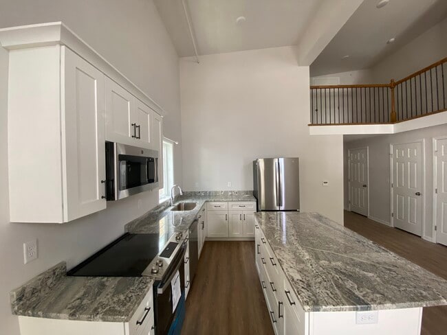 Kitchen Area with Balcony overhead - 30 E Center St