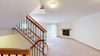 Located at 2735 Westminster Circle in Allison Park, PA, this three-bedroom, three-bathroom home spans three floors, offering a well-organized layout with a generous amount of living space. The main living level features a spacious living room with plush carpeting, crown molding, and a wood-framed corner fireplace as a central focal point. Sliding glass doors lead to a private balcony, allowing natural light to pour in and providing pleasant outdoor views of the surrounding neighborhood.

The kitchen is equipped with warm oak cabinetry, granite-look countertops, tile flooring, and a full suite of white appliances including a dishwasher, range, microwave, and side-by-side refrigerator. The main level also includes an entrance, hallway, and utility room for added convenience.

Upstairs, the three bedrooms are carpeted and bright, with windows overlooking the exterior. The primary bedroom is a comfortable size and is complemented by an en-suite bathroom featuring a built-in vanity with ample counter space and tile flooring. The additional bathrooms include tub-shower combinations, wood-toned cabinetry, and tile floors. Stairways throughout the home feature wood handrails with black metal balusters. Six closets are distributed across the home, providing excellent storage throughout.