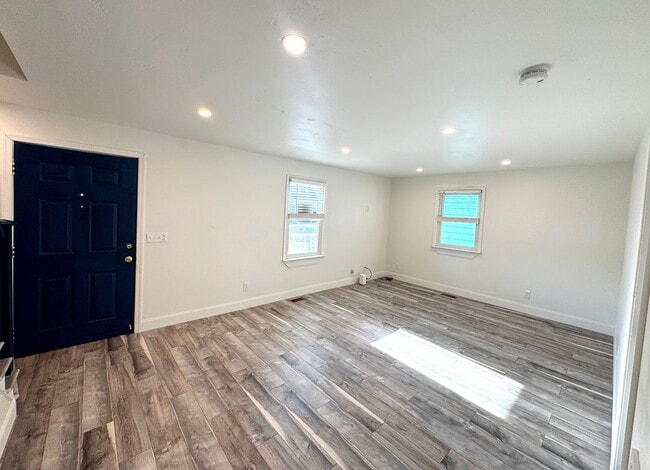 Building Photo - RENOVATED 3 bedroom end unit across the street from the Beach!