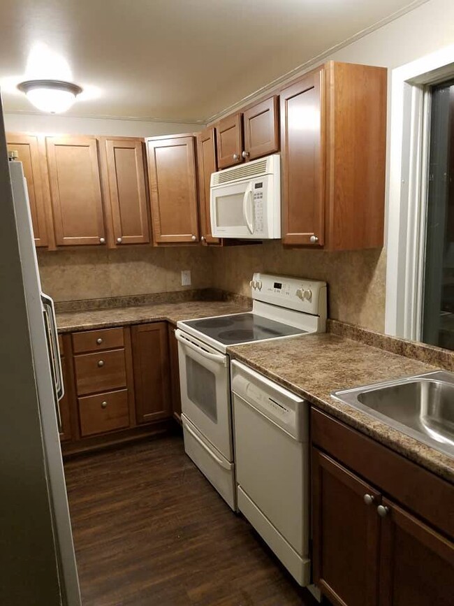 Kitchen with refrigerator, stove, microwave and dishwasher - 10 East State Street