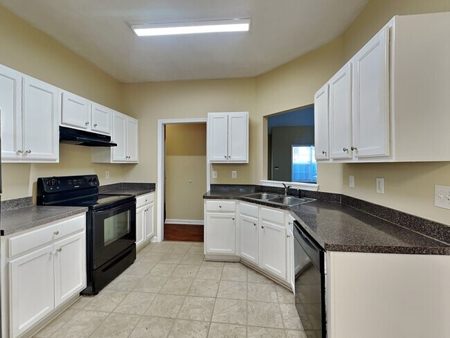 Building Photo - One Month Free! Spacious 4 Bed Home locate...